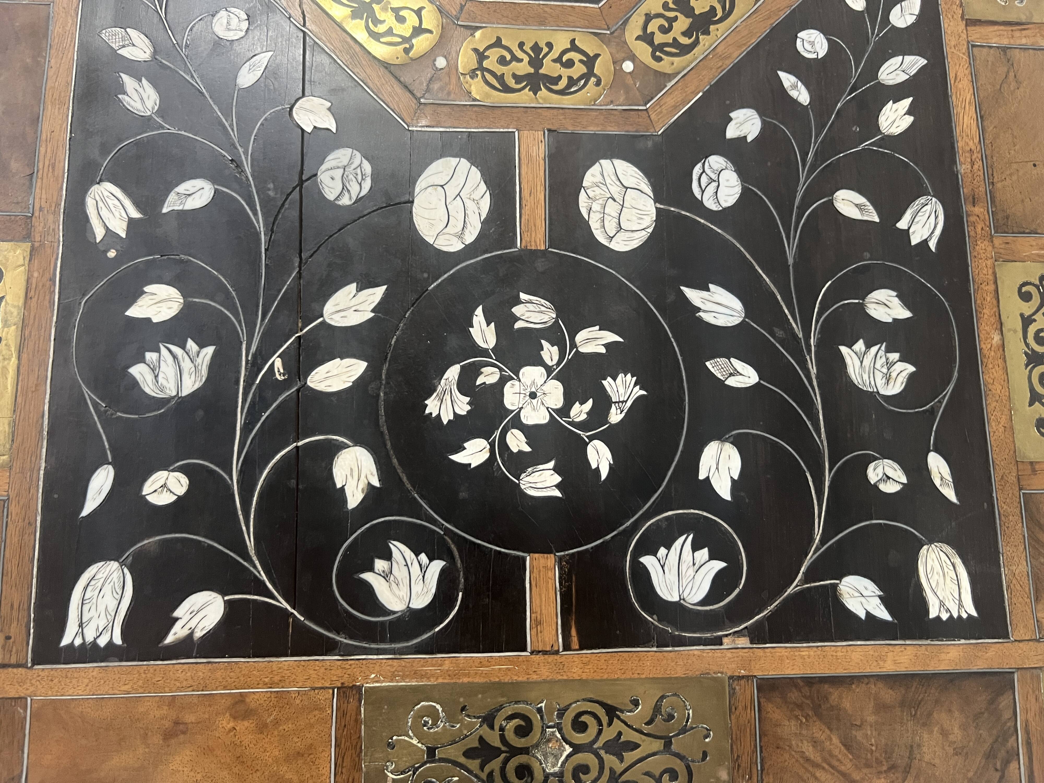 Blackened wood display table with marquetry top, Spain, 19th century.