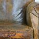 Green antique English cowhide leather armchair on wheels