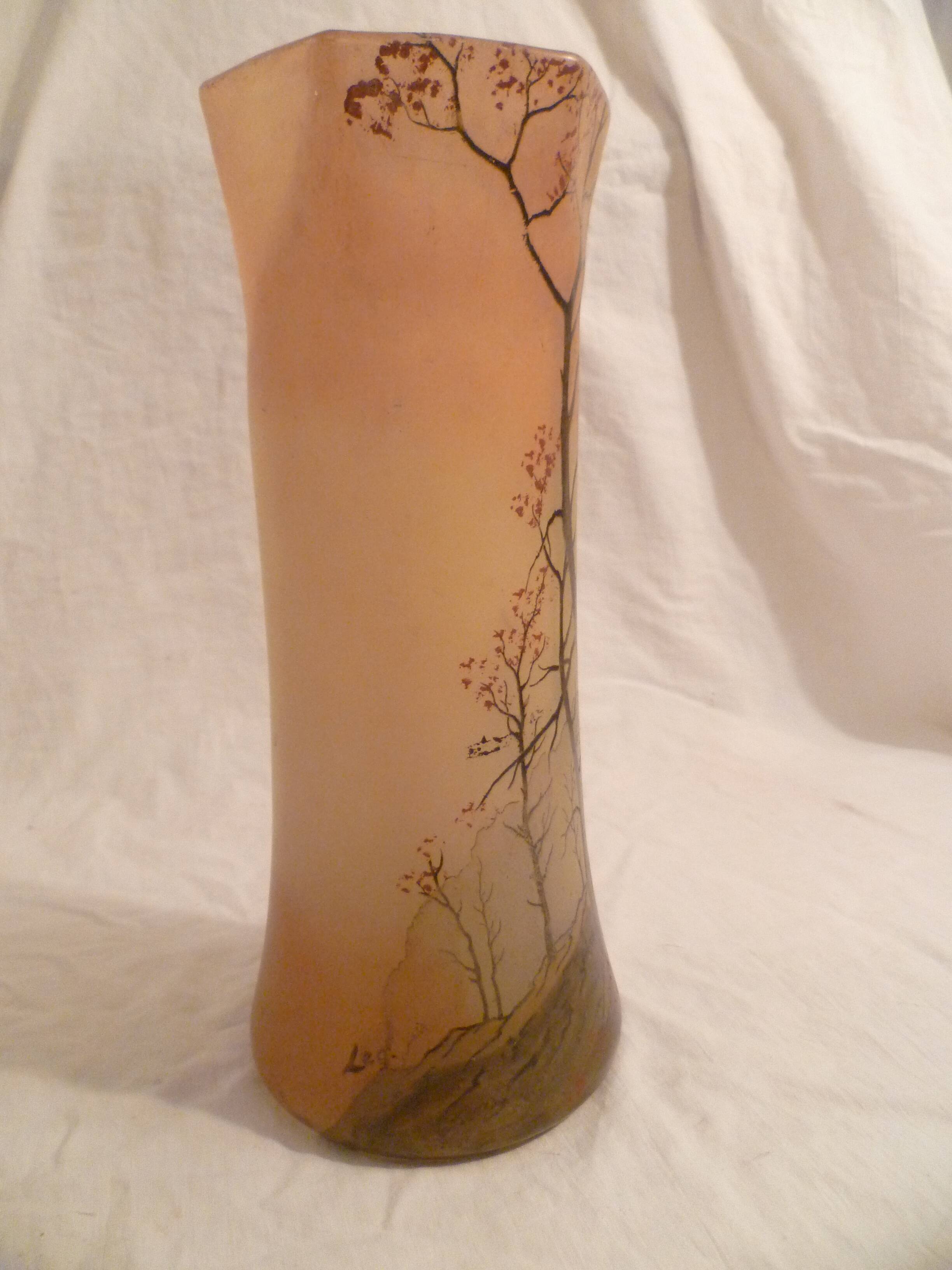Blown glass vase with painted underbrush decoration marked "leg"