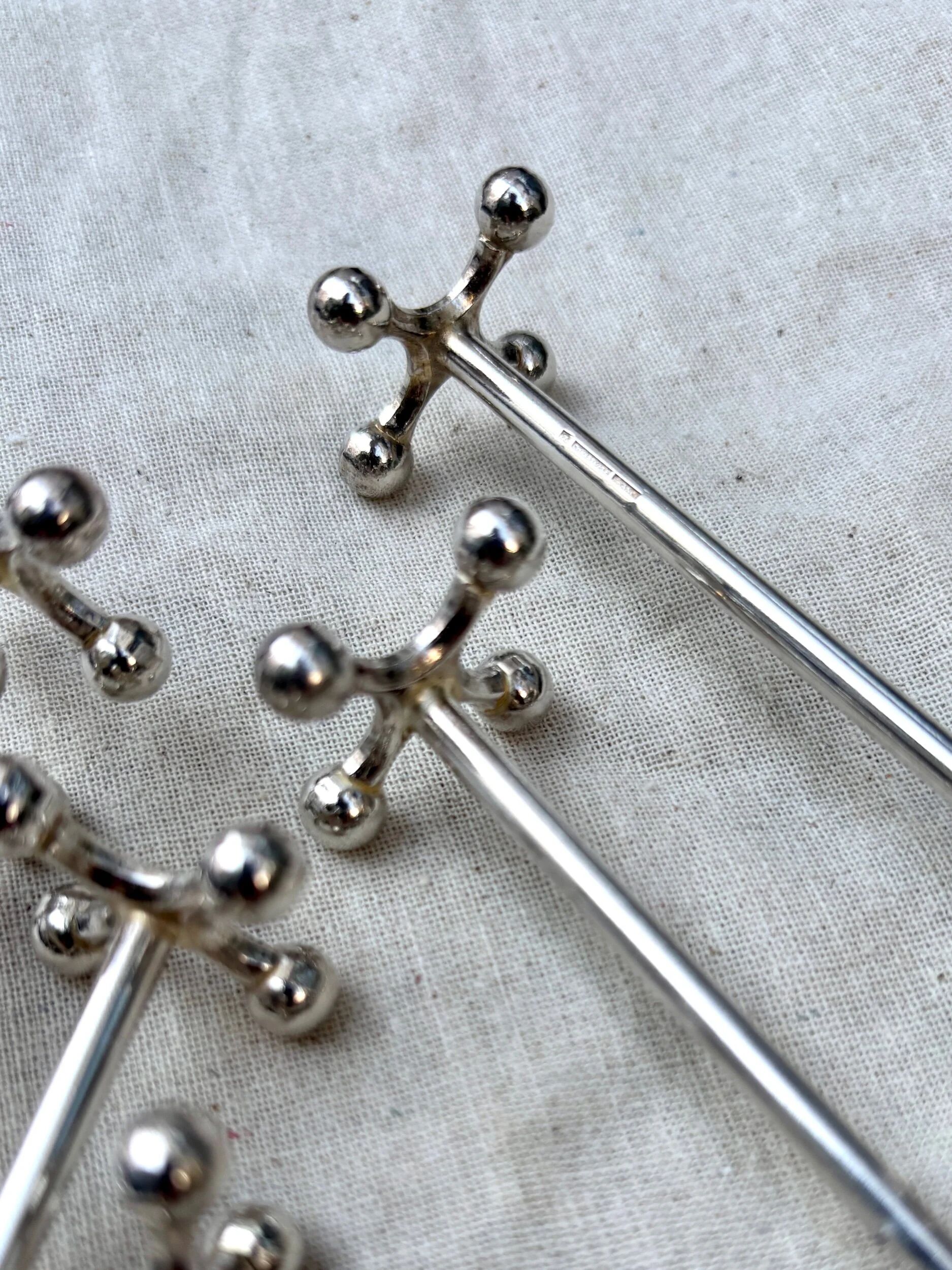 6 Christofle silver-plated knife rests