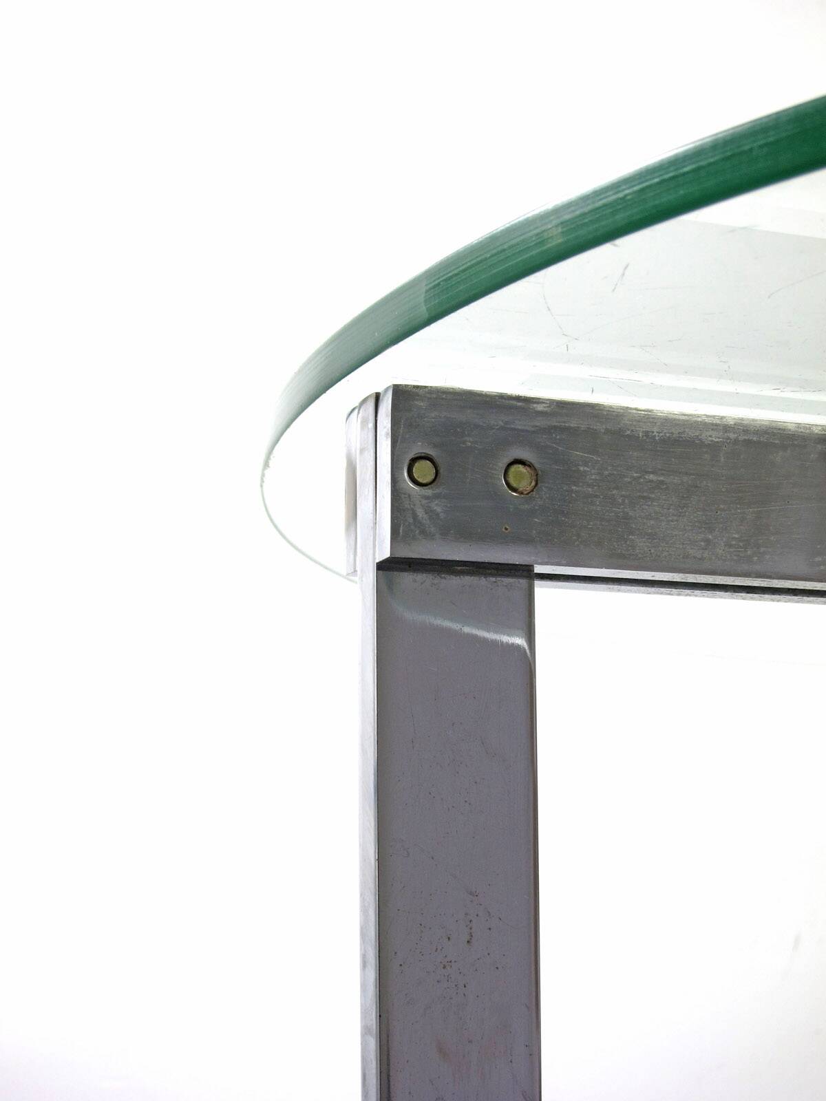 Modernist glass coffee table with stainless steel base