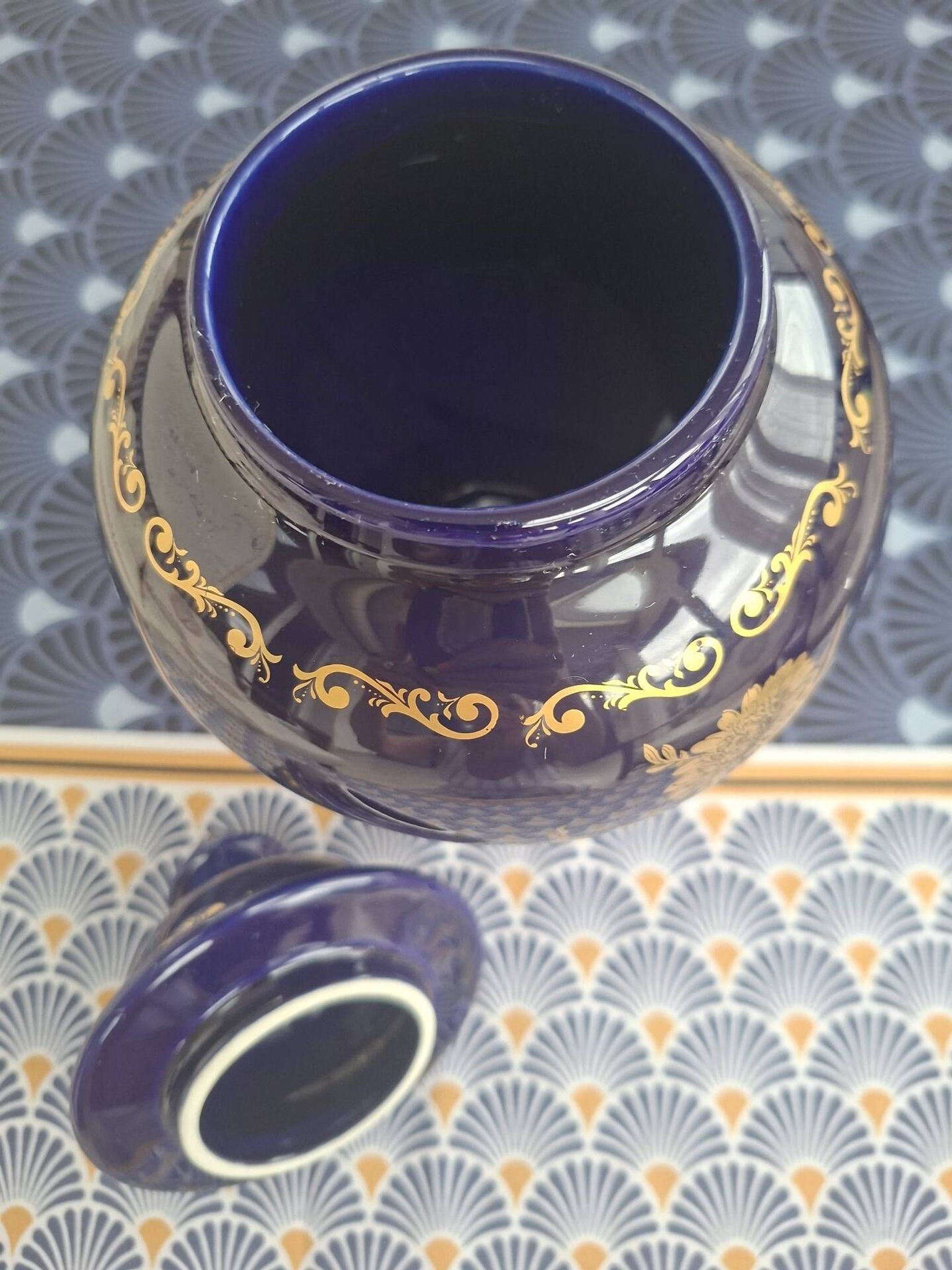 Cobalt blue porcelain bonbonnière with gold decoration on feet.