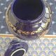 Cobalt blue porcelain bonbonnière with gold decoration on feet.