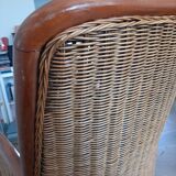 Armchair in woven rattan and exotic wood