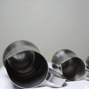 Set of 4 vintage bar measures in brushed stainless steel from the 60s-70s.