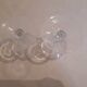 Two small crystal champagne glasses with twisted stems.