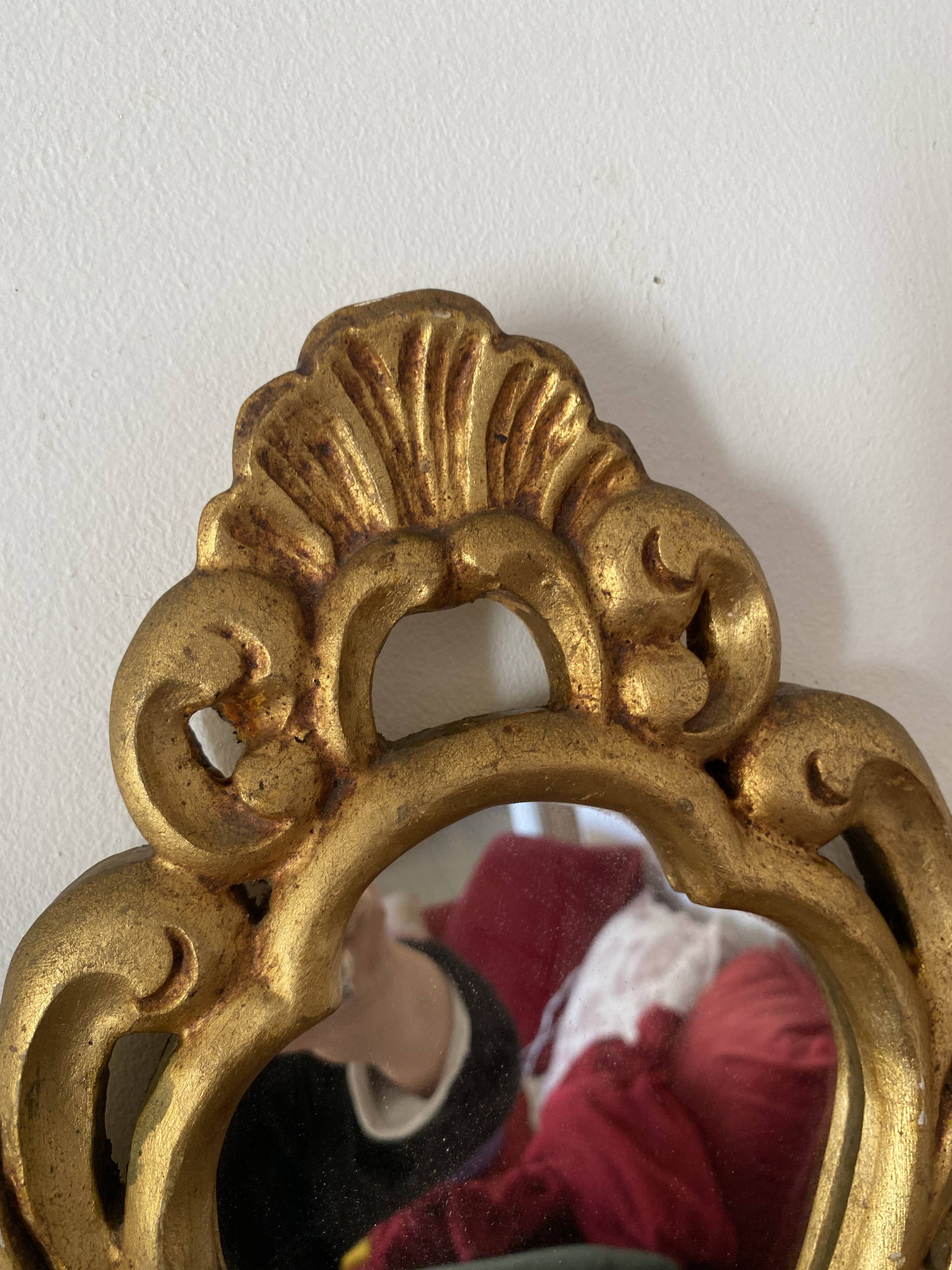 Golden mirror in baroque style.