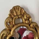 Golden mirror in baroque style.