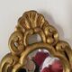 Golden mirror in baroque style.
