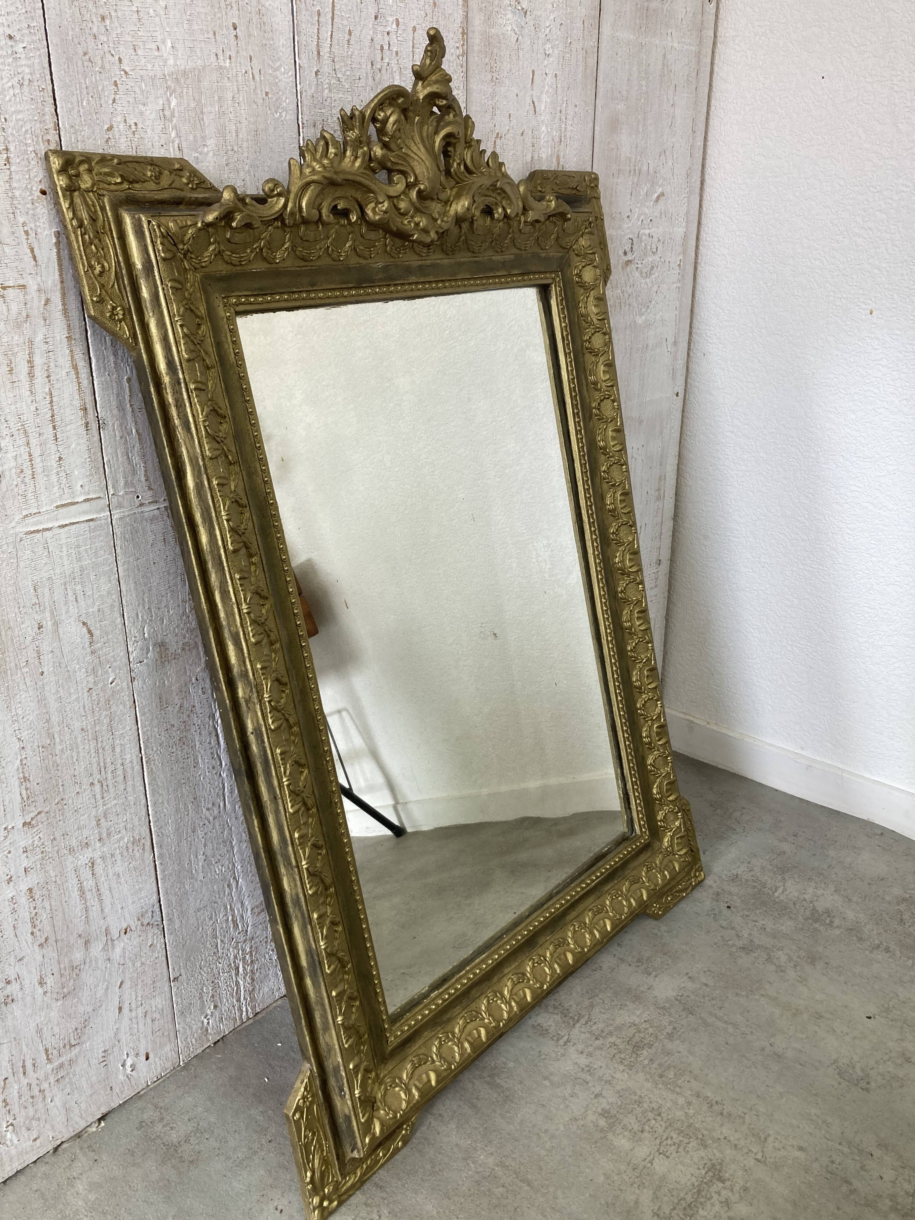 Antique mirror with a pediment