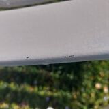 pair of white metal chairs, Tolix style