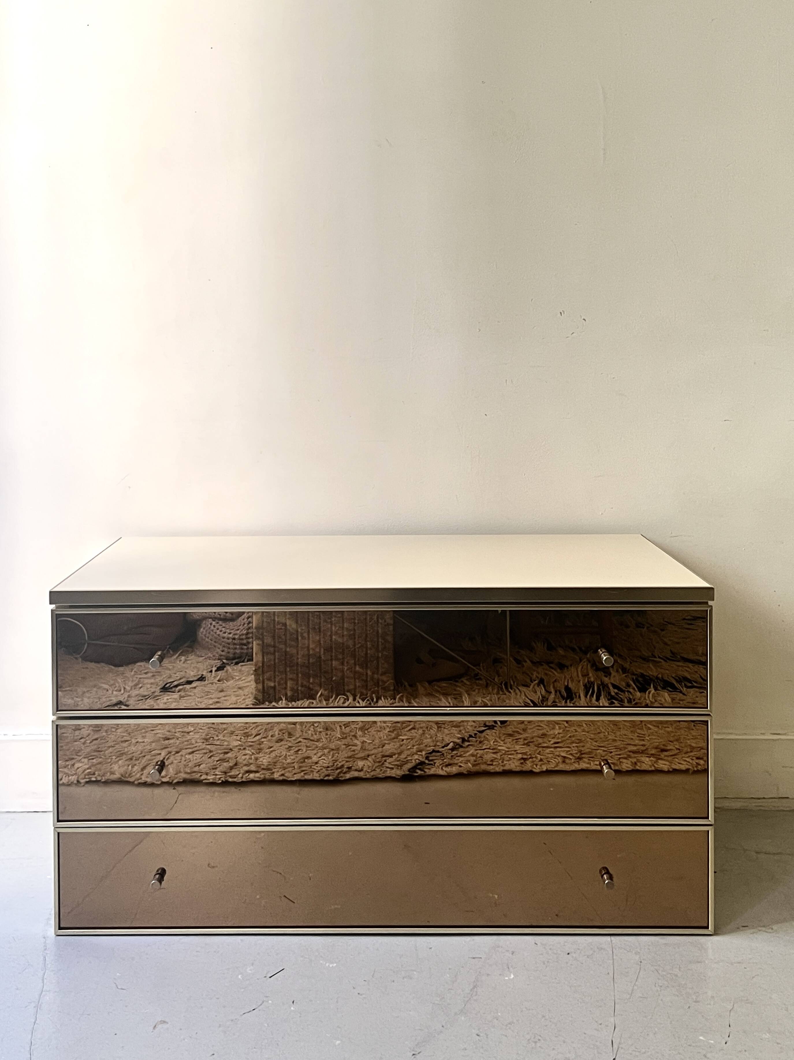 Ivory lacquered sideboard with polished finish and smoked mirror, JC Mahey design 1970.