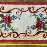 Vintage wool rug with floral decor