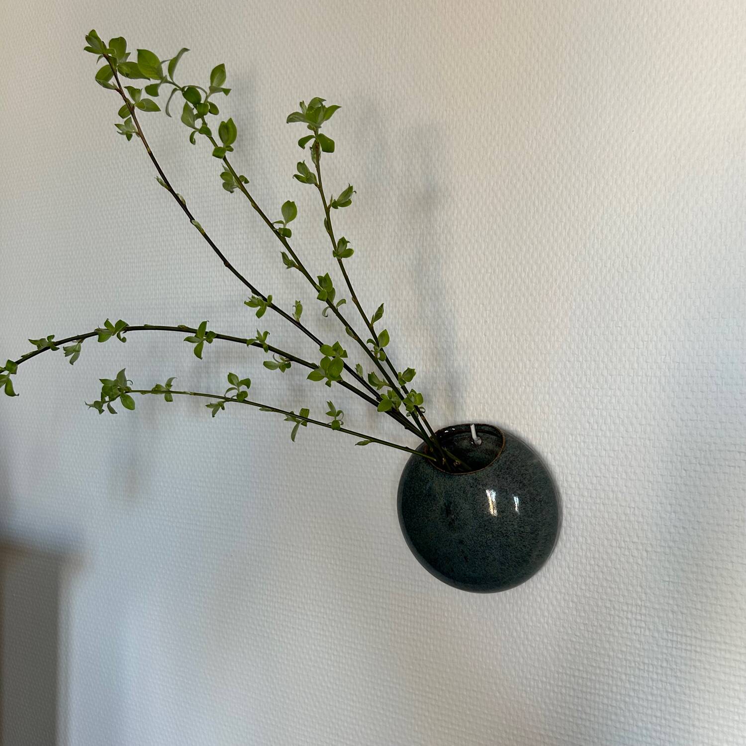Wall vase in blue stoneware, signed