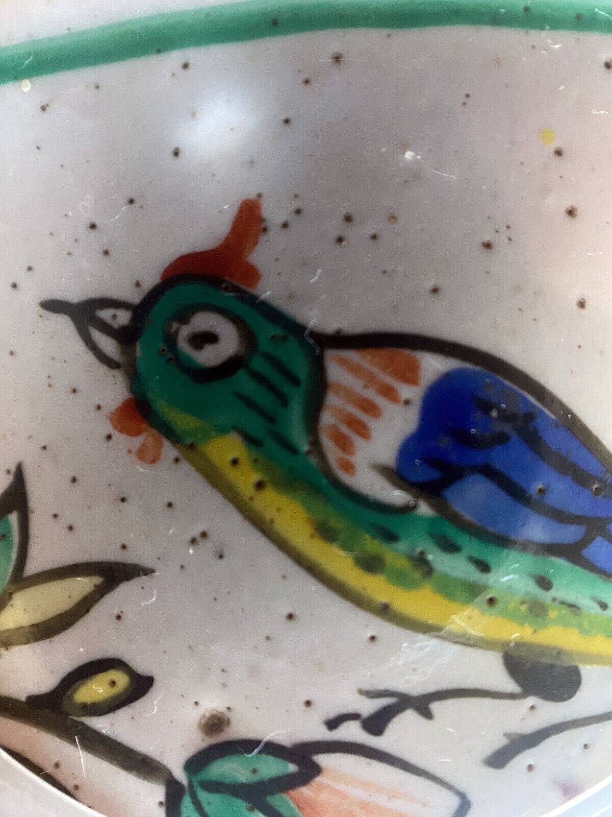 Old ceramic pitcher (18th century?) decorated with polychrome exotic birds