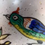 Old ceramic pitcher (18th century?) decorated with polychrome exotic birds