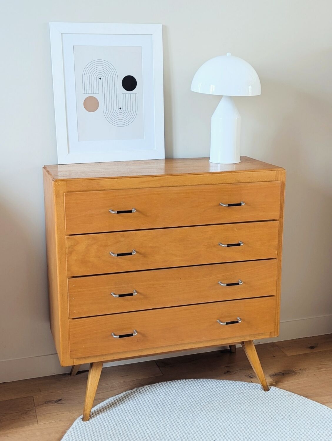 Vintage chest of drawers with tapered legs from the 1960s.