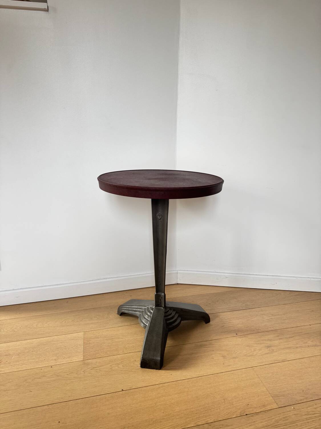 Rare Louis Vuitton cast iron bistro table with a bakelite top.