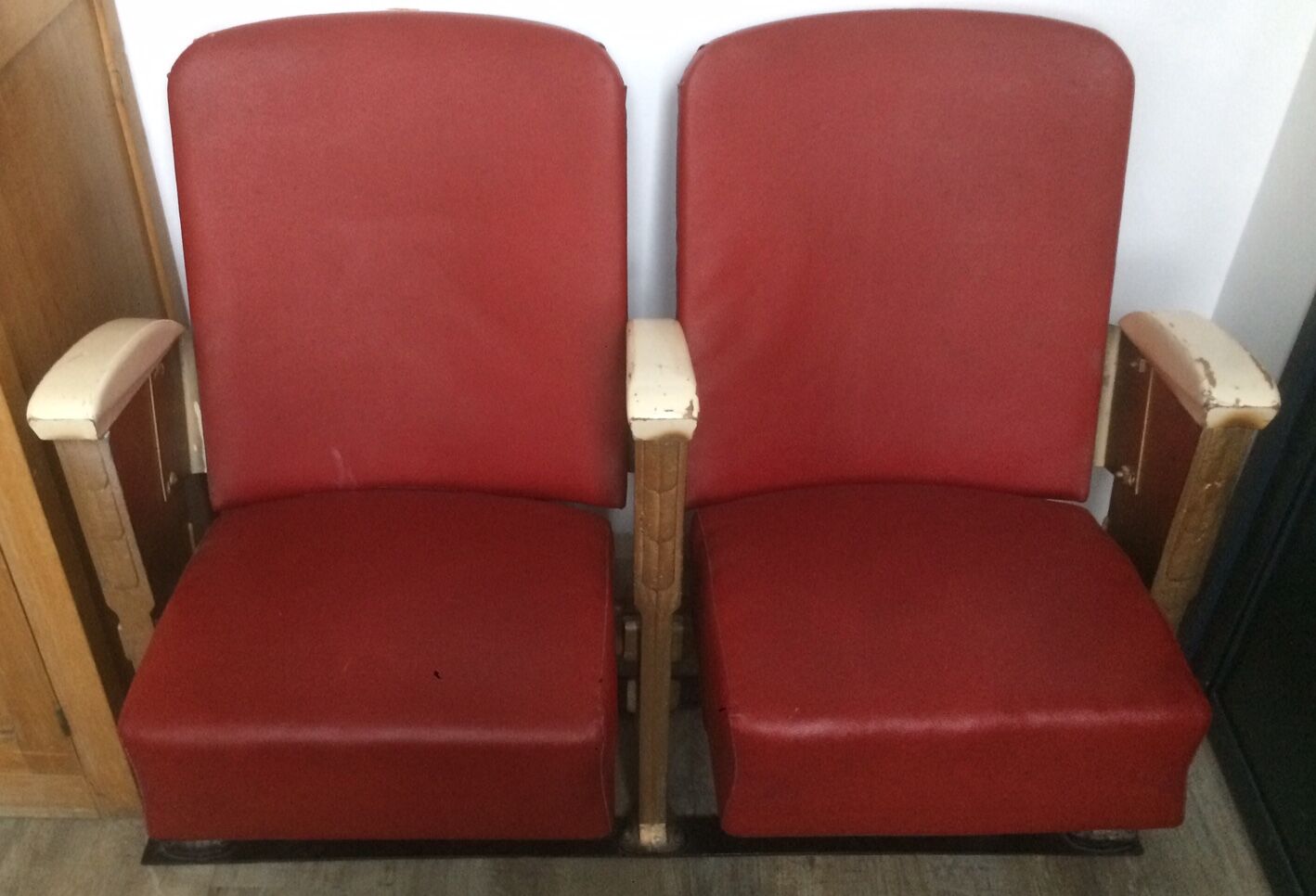 Pair of red skai leather cinema chairs