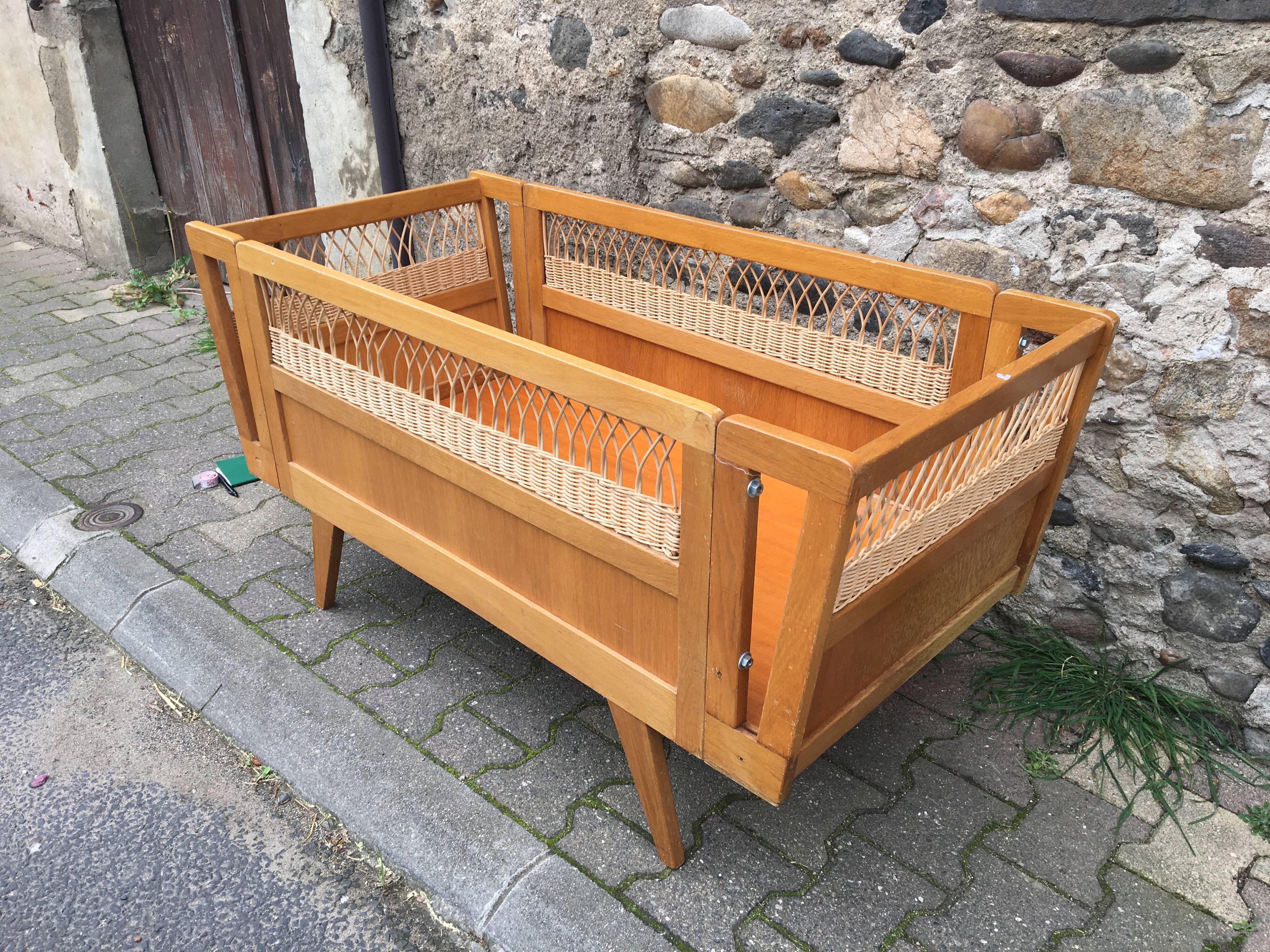 Wooden and rattan baby bed
