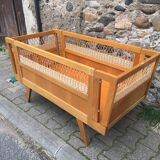 Wooden and rattan baby bed