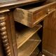 Ornamental piece of solid wood furniture, richly carved, dating from the 17th century.
