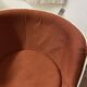 Two cognac-colored swivel chairs made of fiberglass from the 1970s