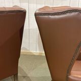 Pair of brown leather wingback Chesterfield armchairs from the 1970s.