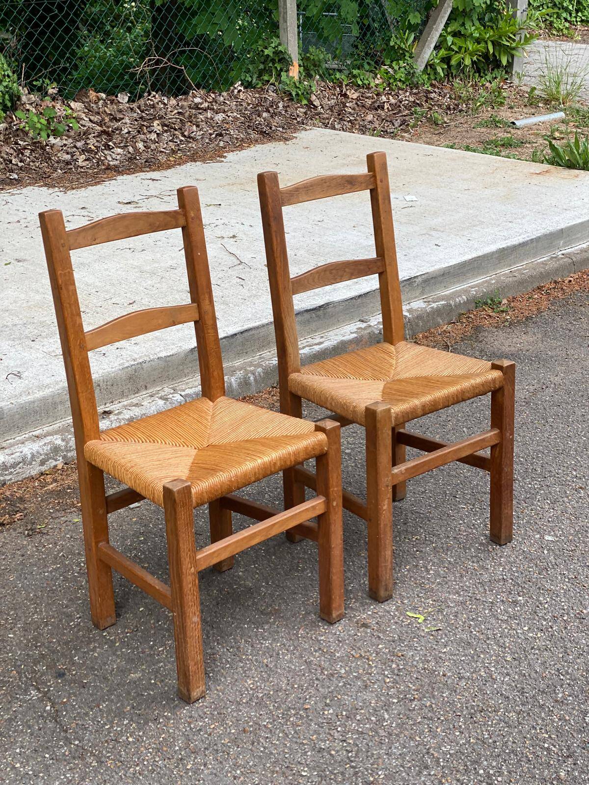 2 solid wood and straw chairs