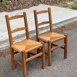 2 solid wood and straw chairs
