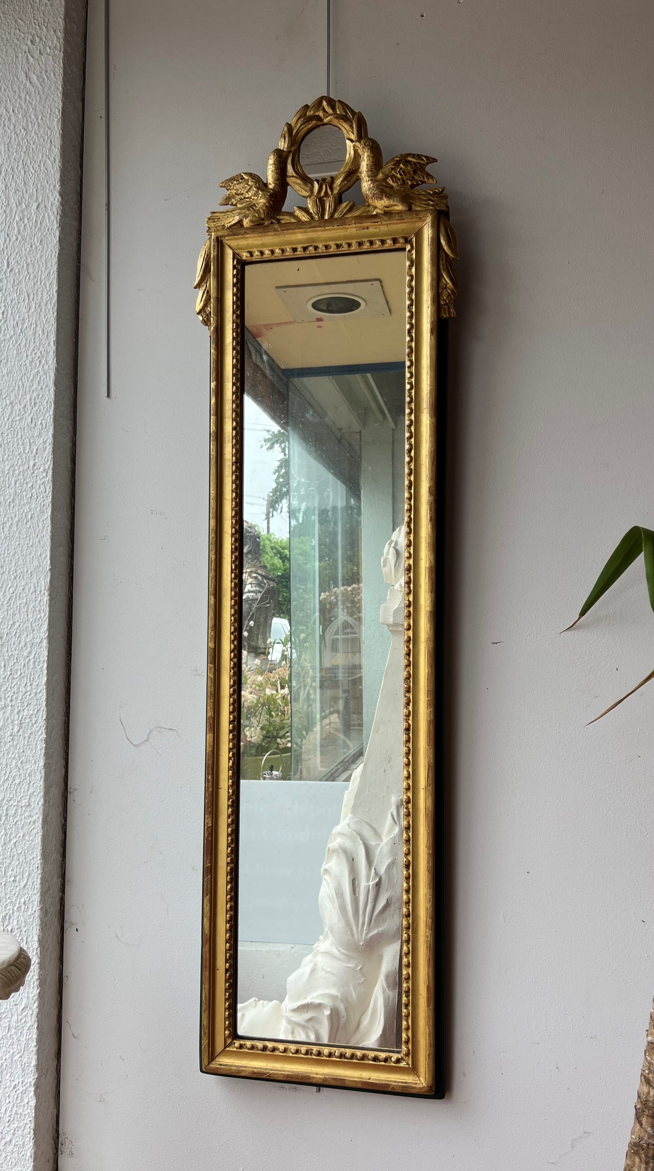 Mirror between two Louis XVI style in gilded wood with leaf around 1900