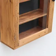 Antique wall display cabinet in natural wood and black – small glass-fronted collector's piece.