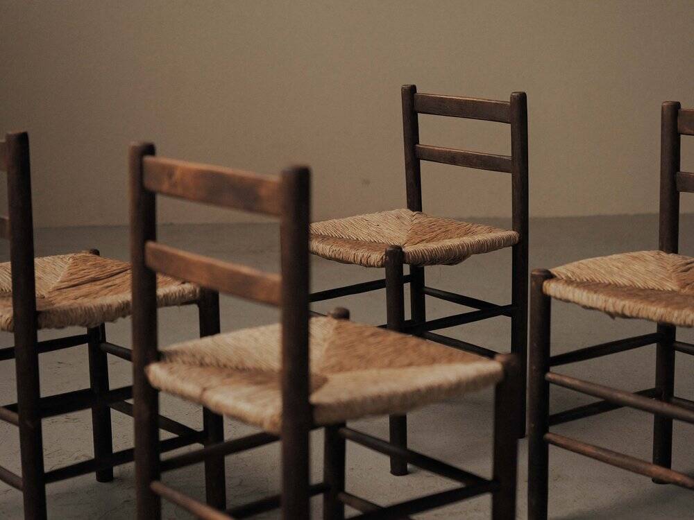 Set of four wooden and straw chairs, around 1960.