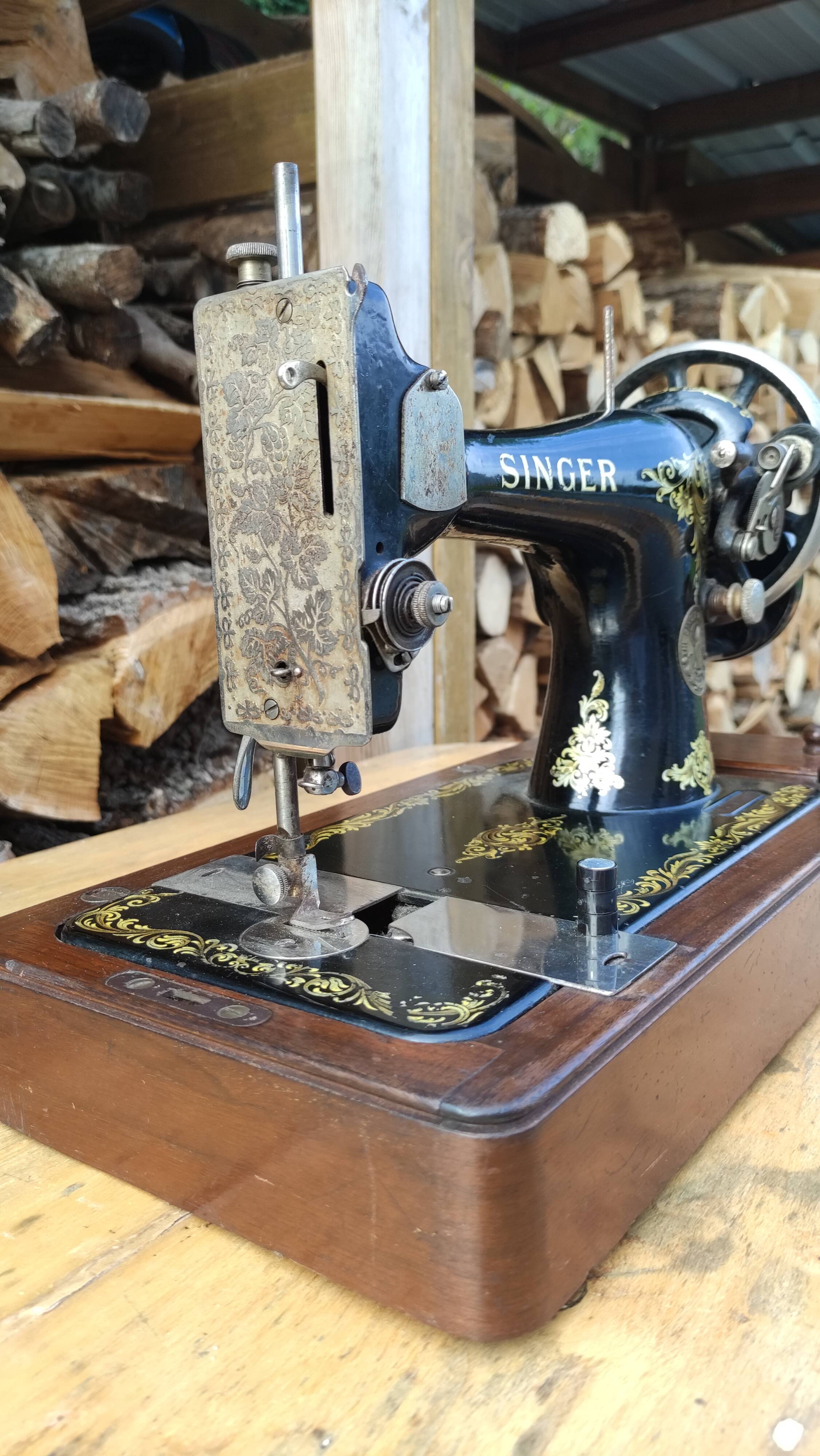 Old Singer sewing machine on its original base