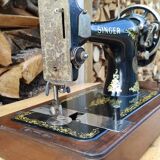 Old Singer sewing machine on its original base