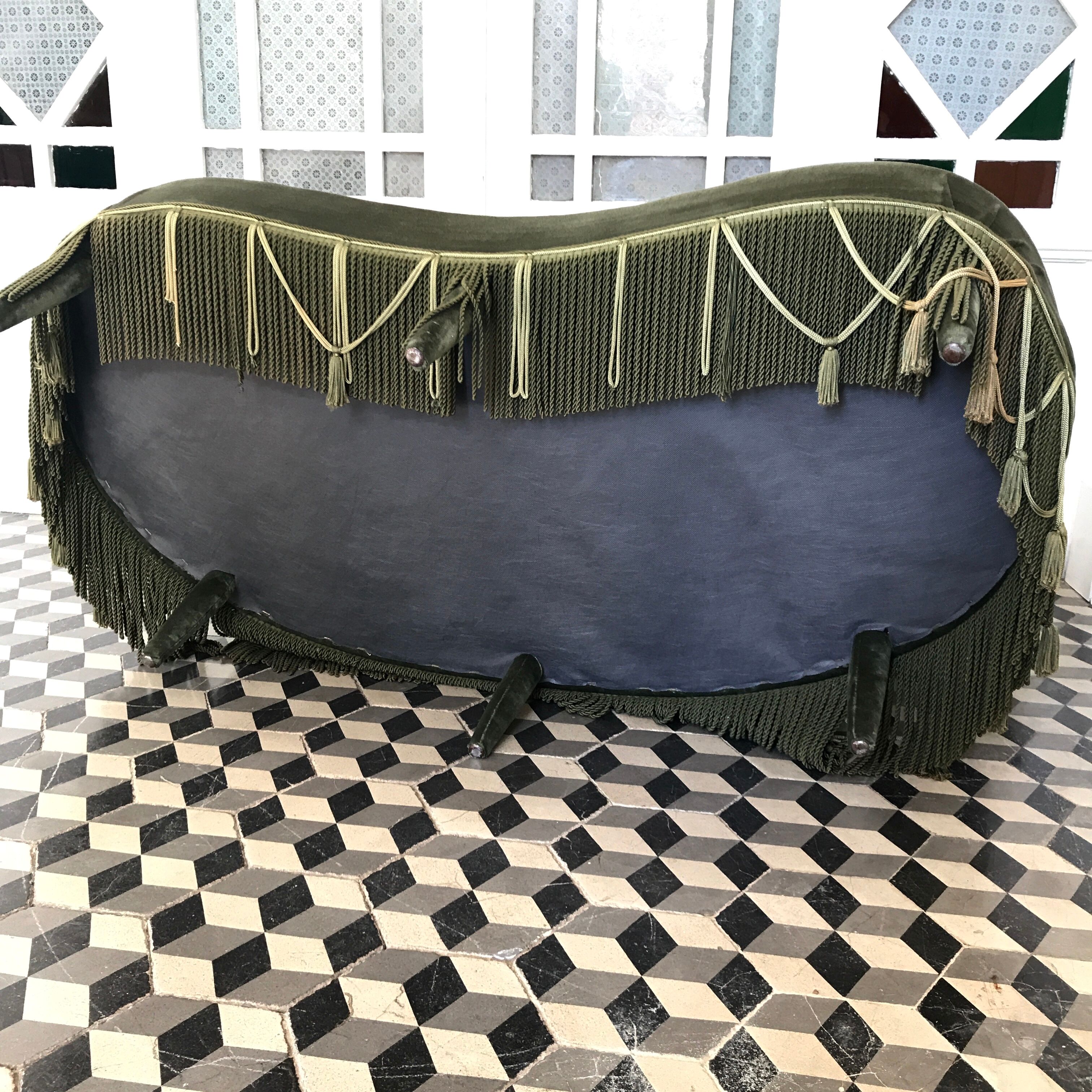 Toad in green velvet sofa