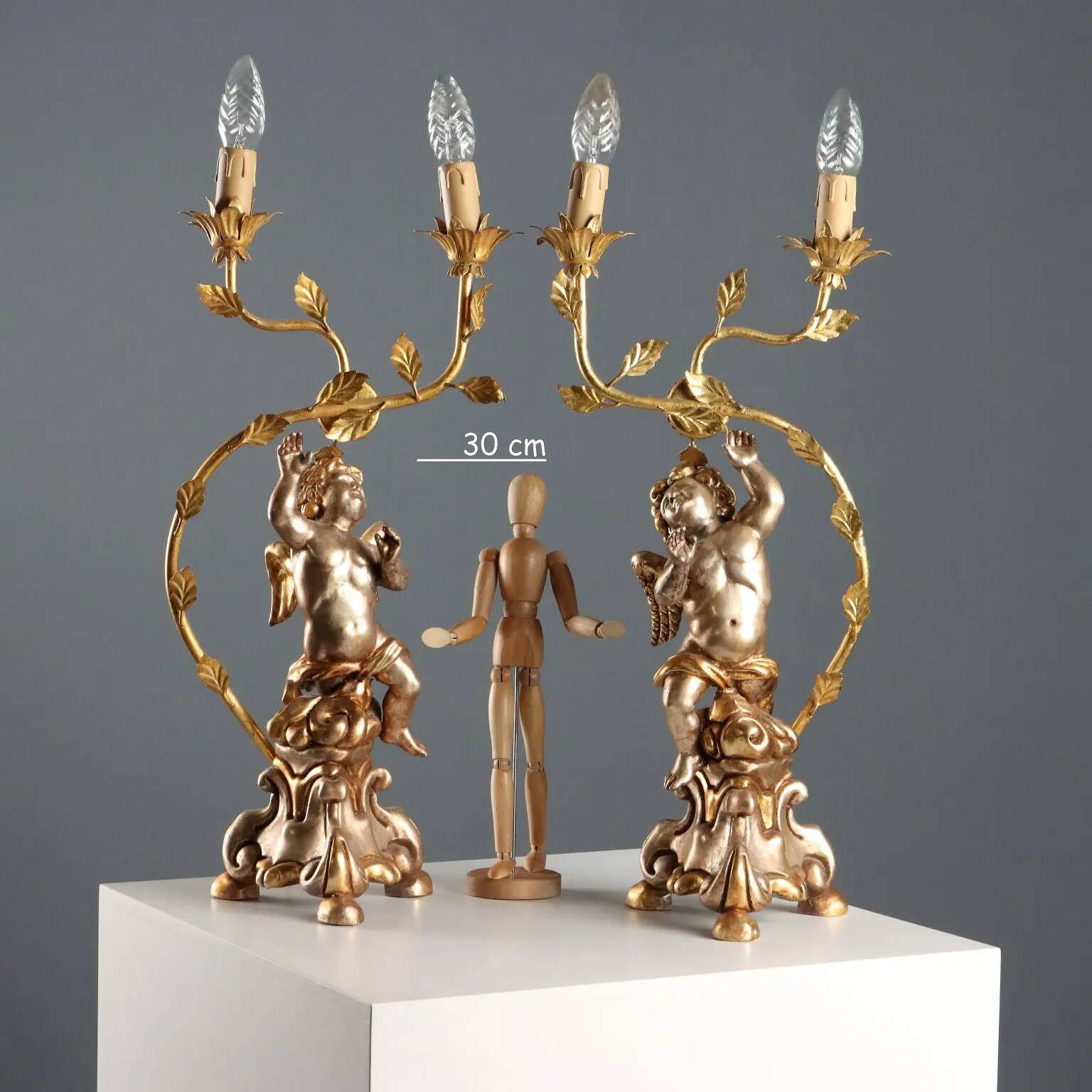 Pair of antique candelabra in carved and gilded wood, Italy, 20th century