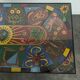 Chrome steel coffee table with zodiac signs decoration.