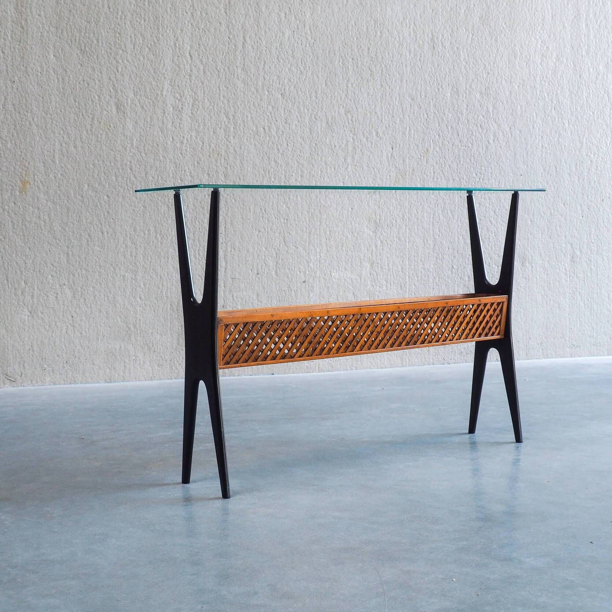 1950s Italian ebonized console table with glass top & lattice basket