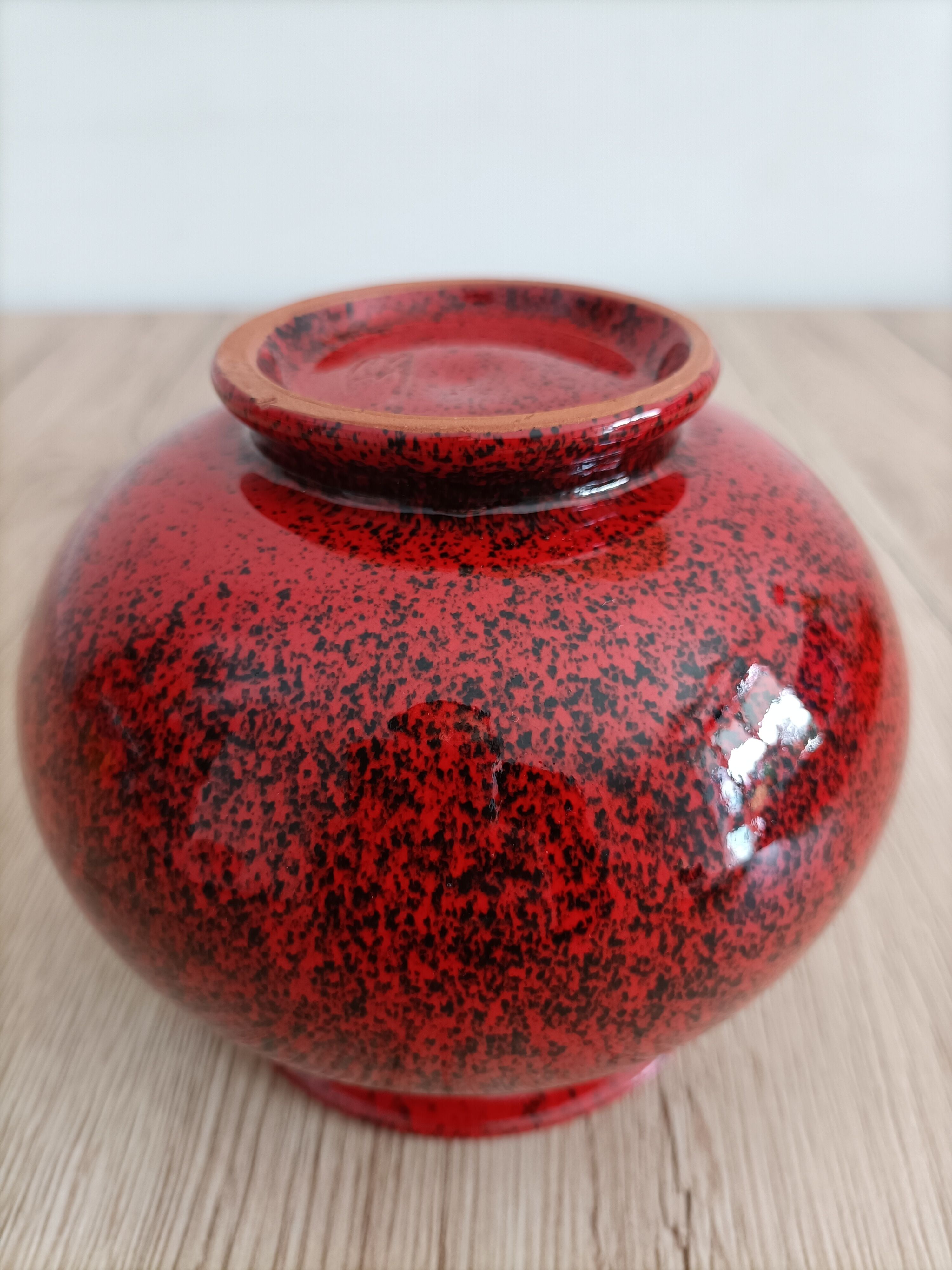 Red and black ceramic vase or pot cover