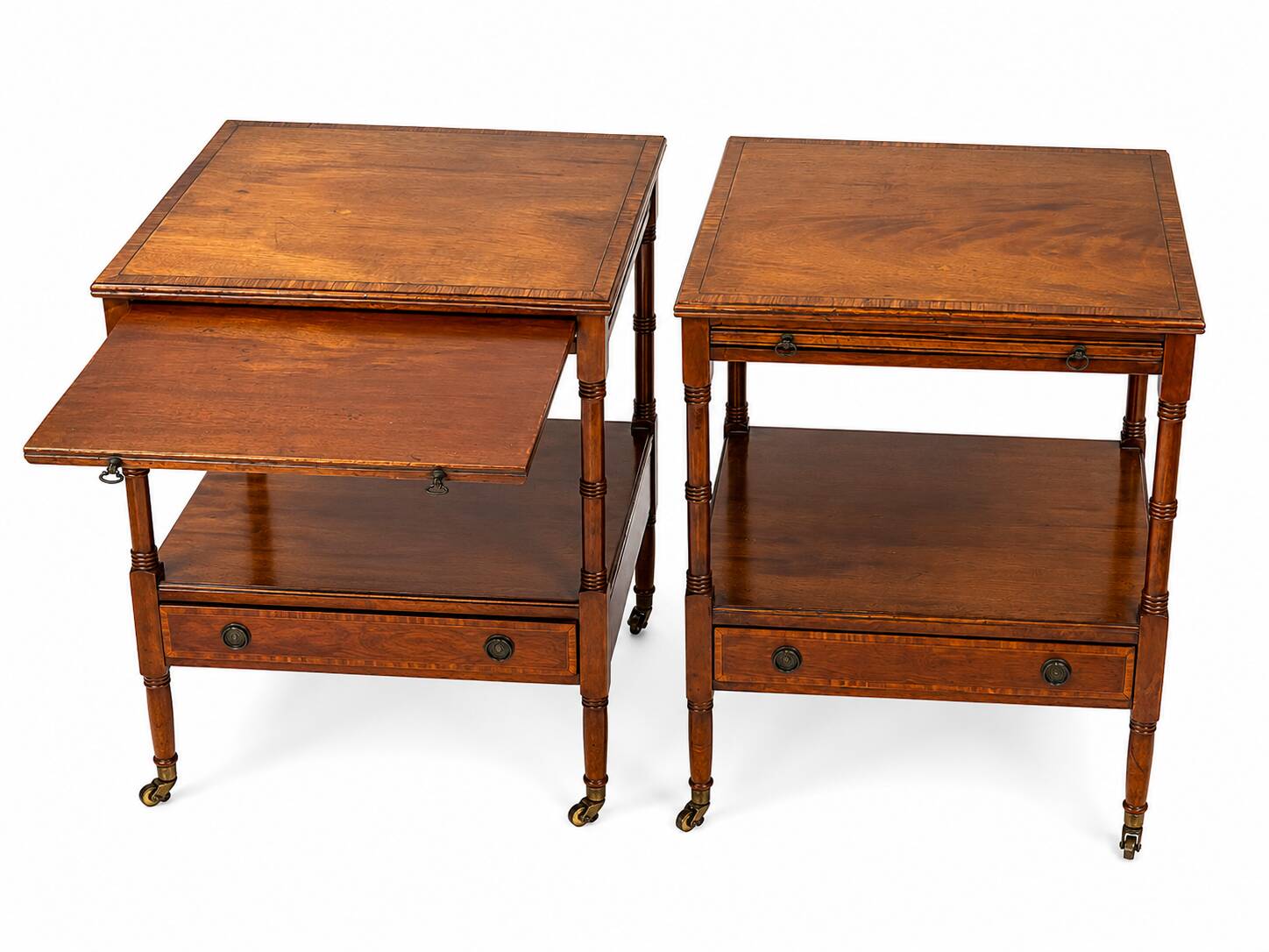 Pair of English mahogany side tables with sliding shelf.