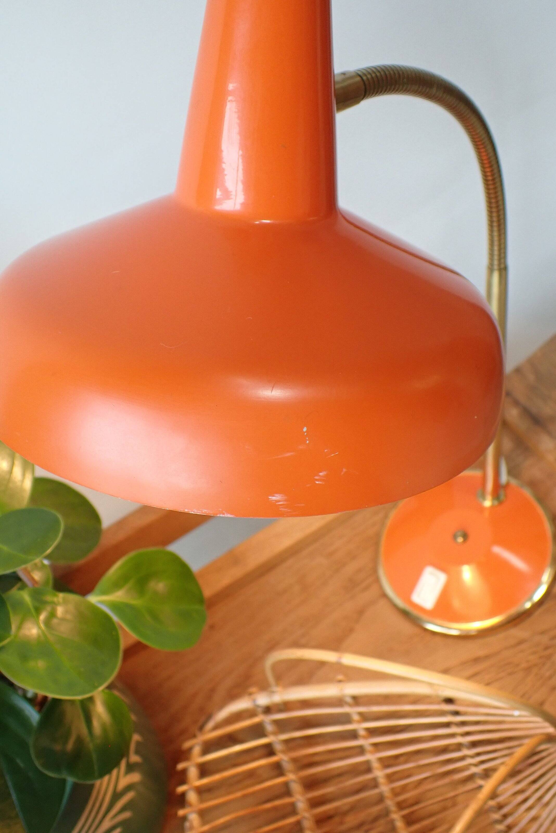 Vintage adjustable lamp, orange, made of metal.