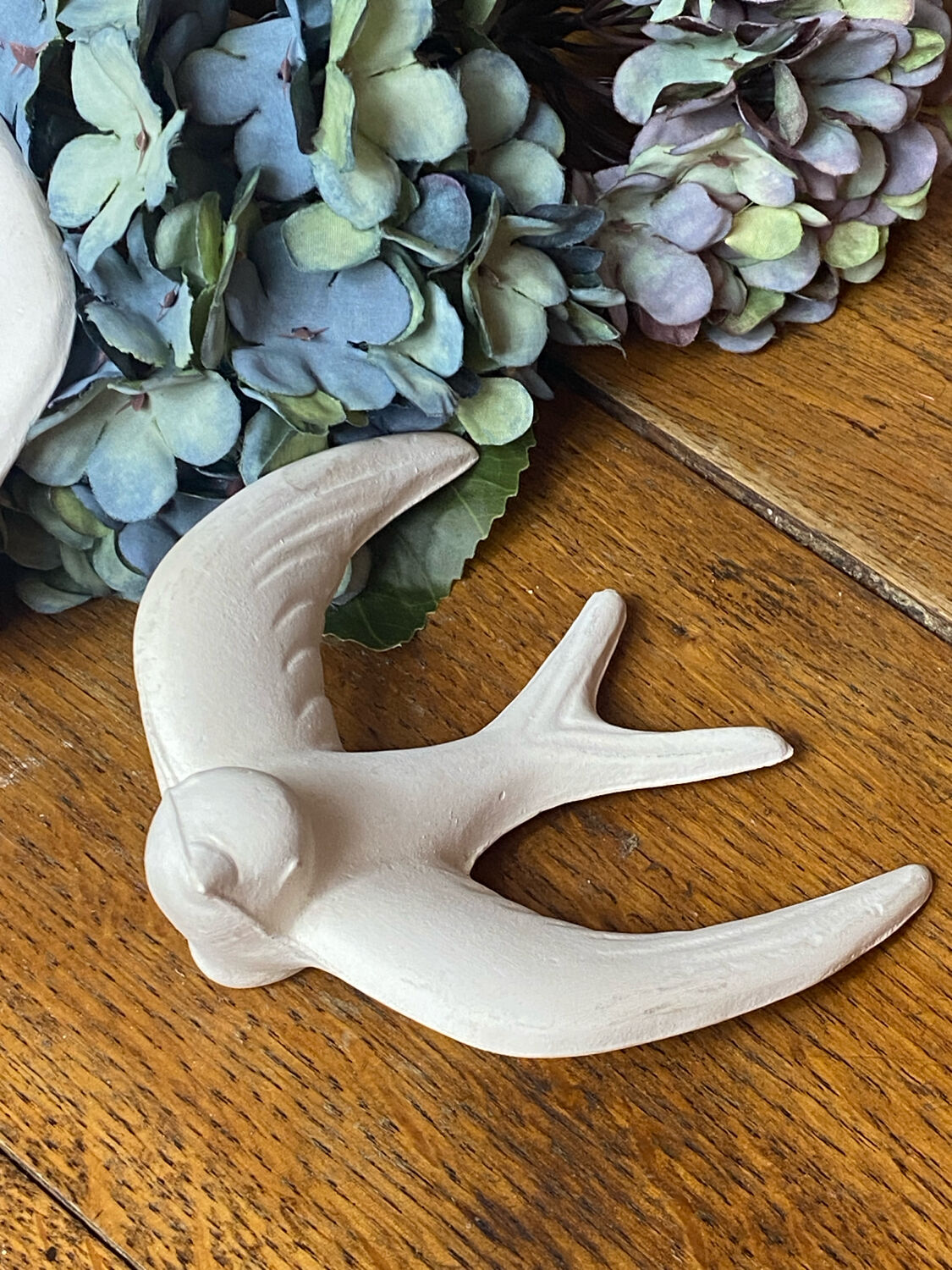 Pair of plaster swallows