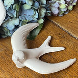 Pair of plaster swallows