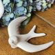 Pair of plaster swallows