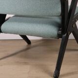 Vintage armchair from the 1960s in black wood and fabric.