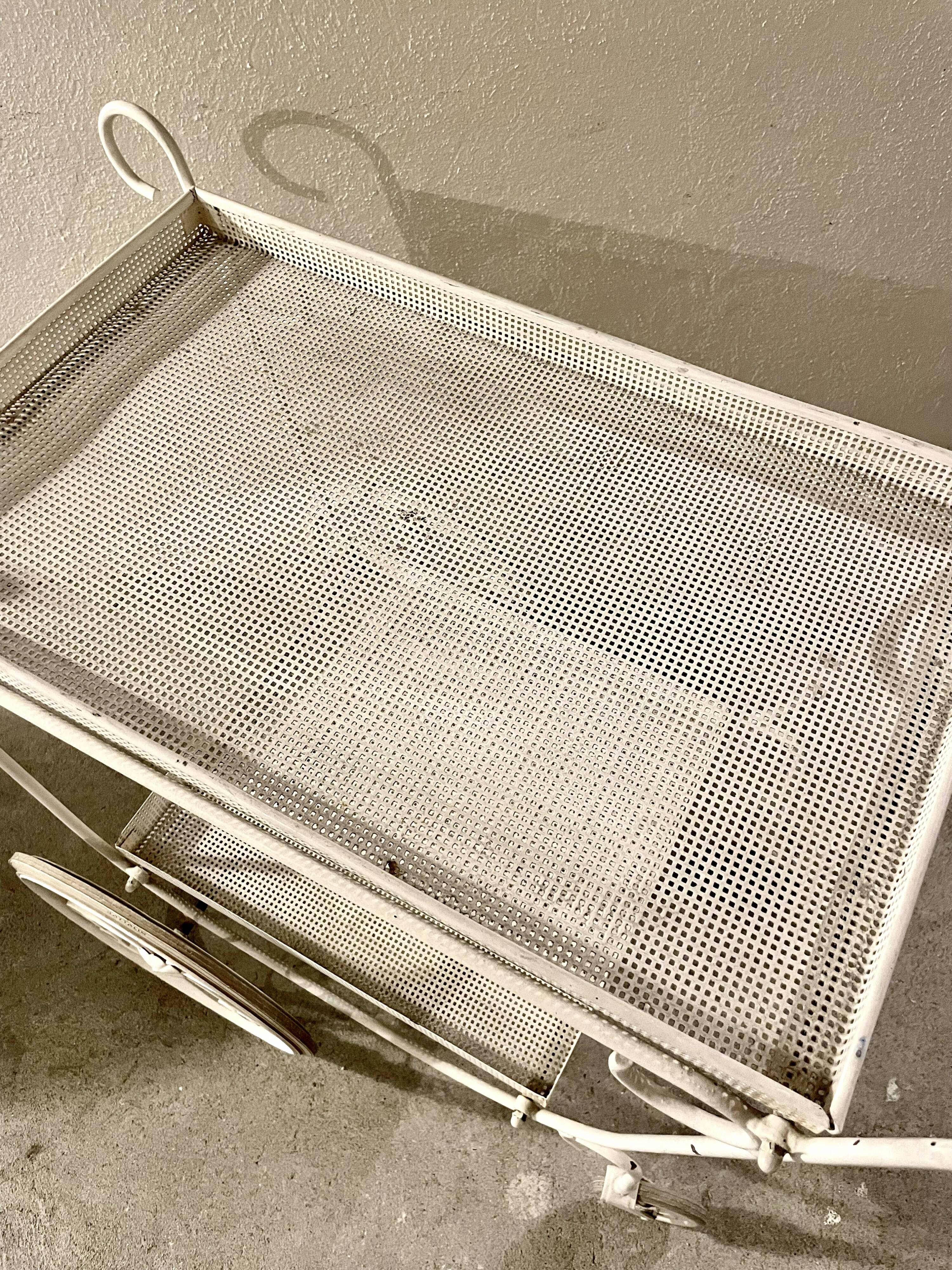 White perforated metal trolley