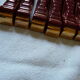 together 12 carries knives and a red enamelled earthenware bottle