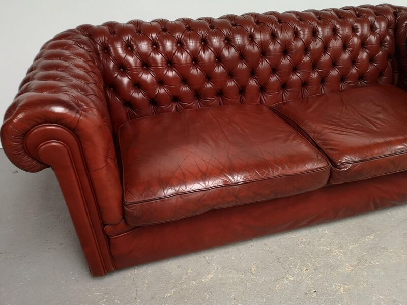 Old red leather Chesterfield sofa