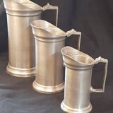 Set of 3 pewter pitchers 95%